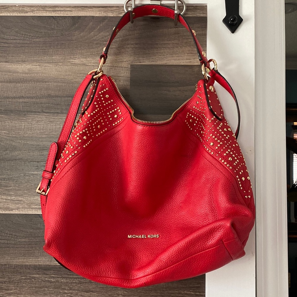 Red with gold studs Michael Kors bag